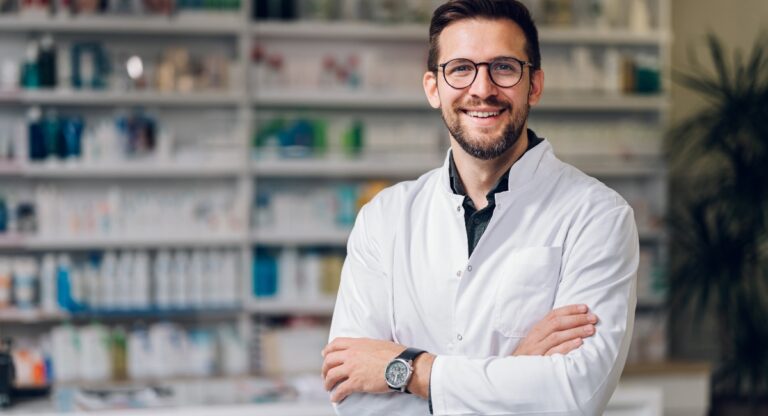Medical practice owner standing in office